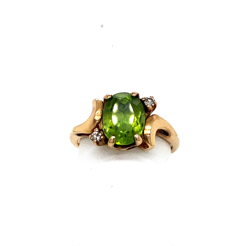 14k Oval Cut Peridot with Two Diamonds Ring