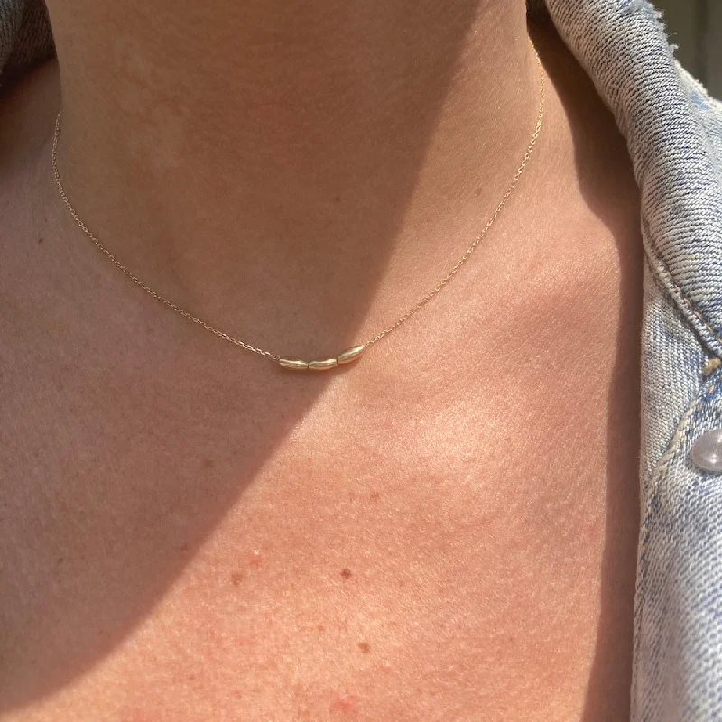 layered gold coin pendant necklace OVAL ORBIT NECKLACE